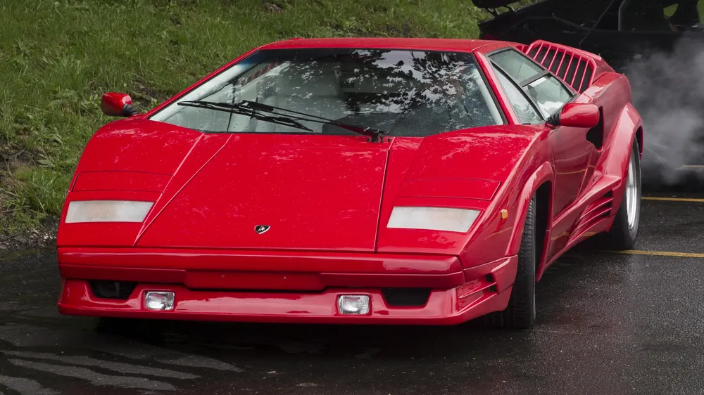 Red Lamborghini Countach 25th Anniversary, front view, on a wet road